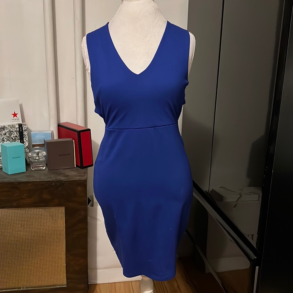Beautiful blue bodycon style dress with a crisscross open back